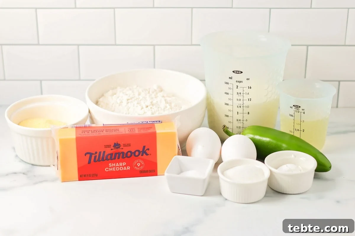 Flour, eggs, cheese, jalapeno and other ingredients on a kitchen counter.