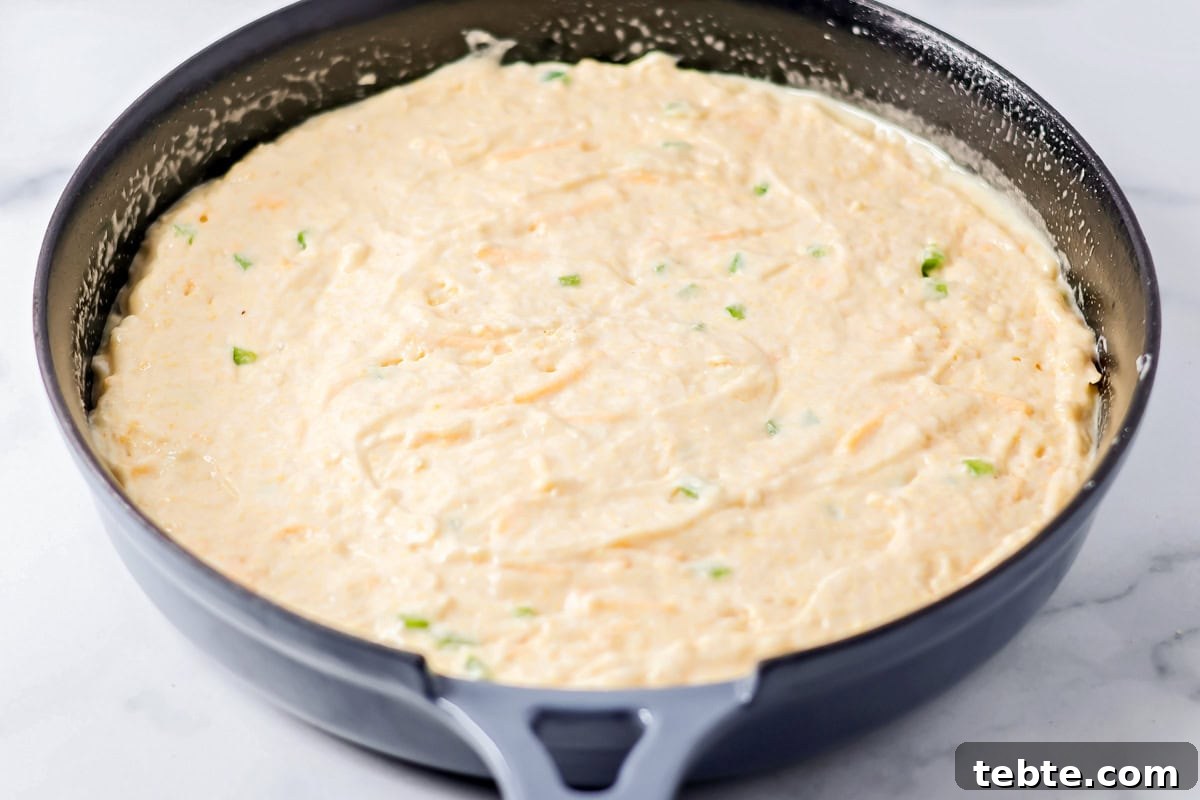 Batter spread in a skillet.