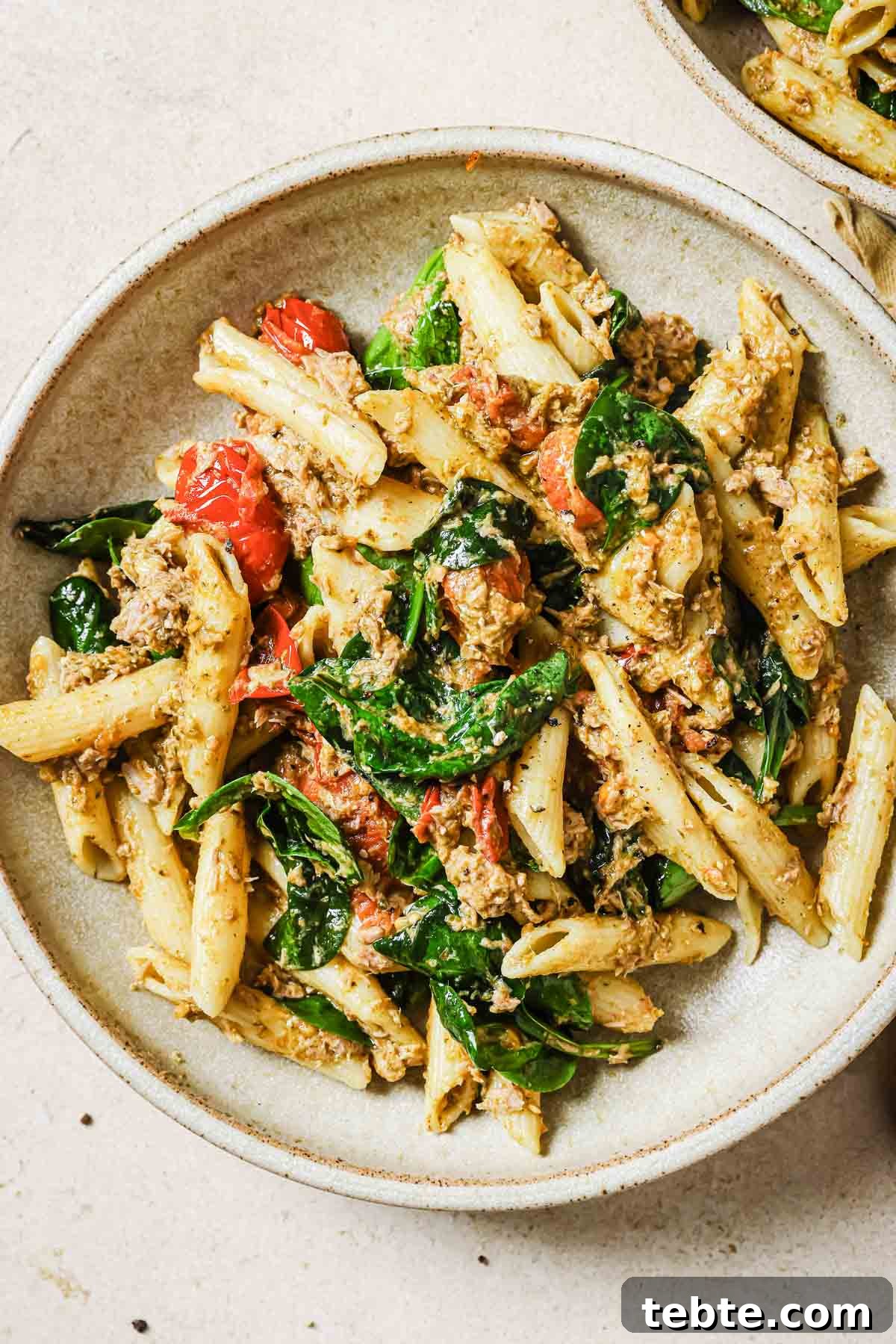 Creamy Tuna Pesto Pasta Recipe for Quick Weeknight Meals 13 Two bowls of tuna pesto pasta.