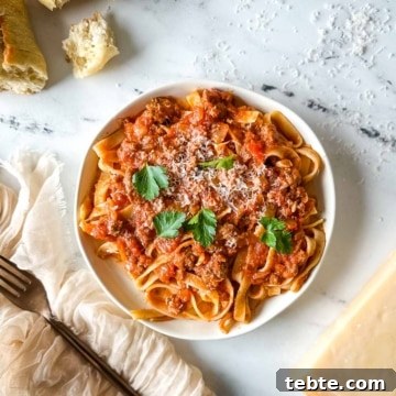 A plate of slow cooker lamb ragu over pappardelle.