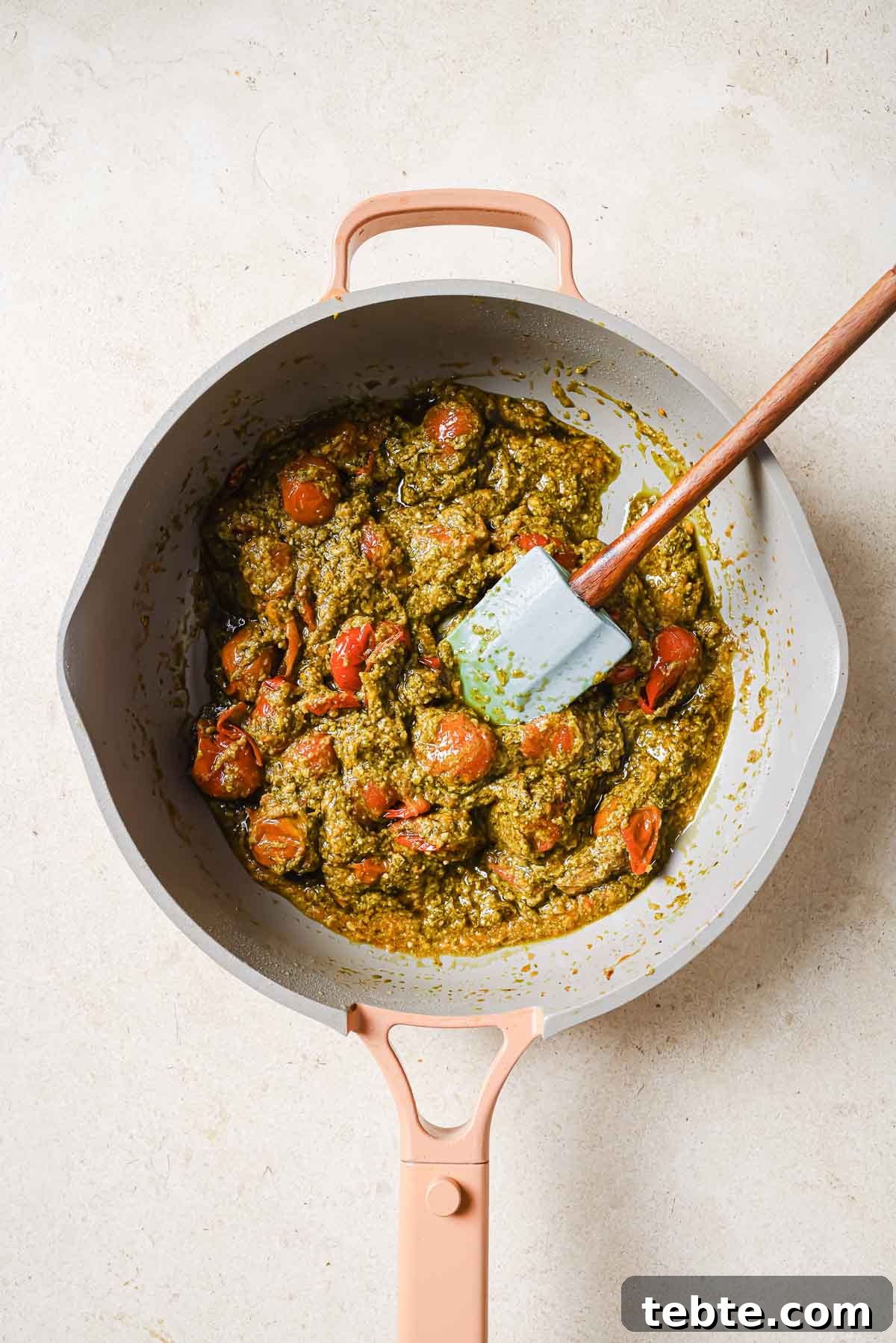 Creamy Tuna Pesto Pasta Recipe for Quick Weeknight Meals 7 A frying pan with tomatoes and pesto.