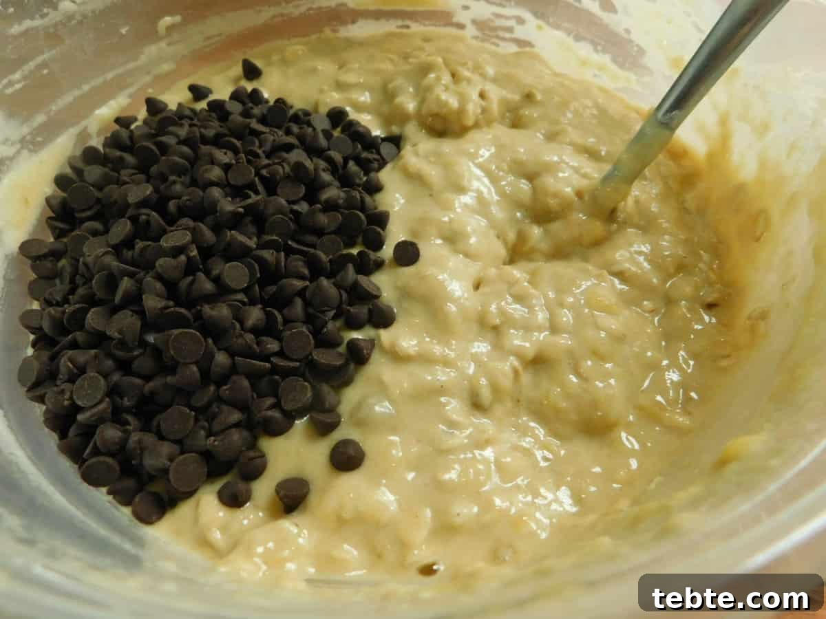 Banana Oatmeal Chocolate Chip Muffins Recipe for Moist, Chewy Treats 5 Batter being mixed