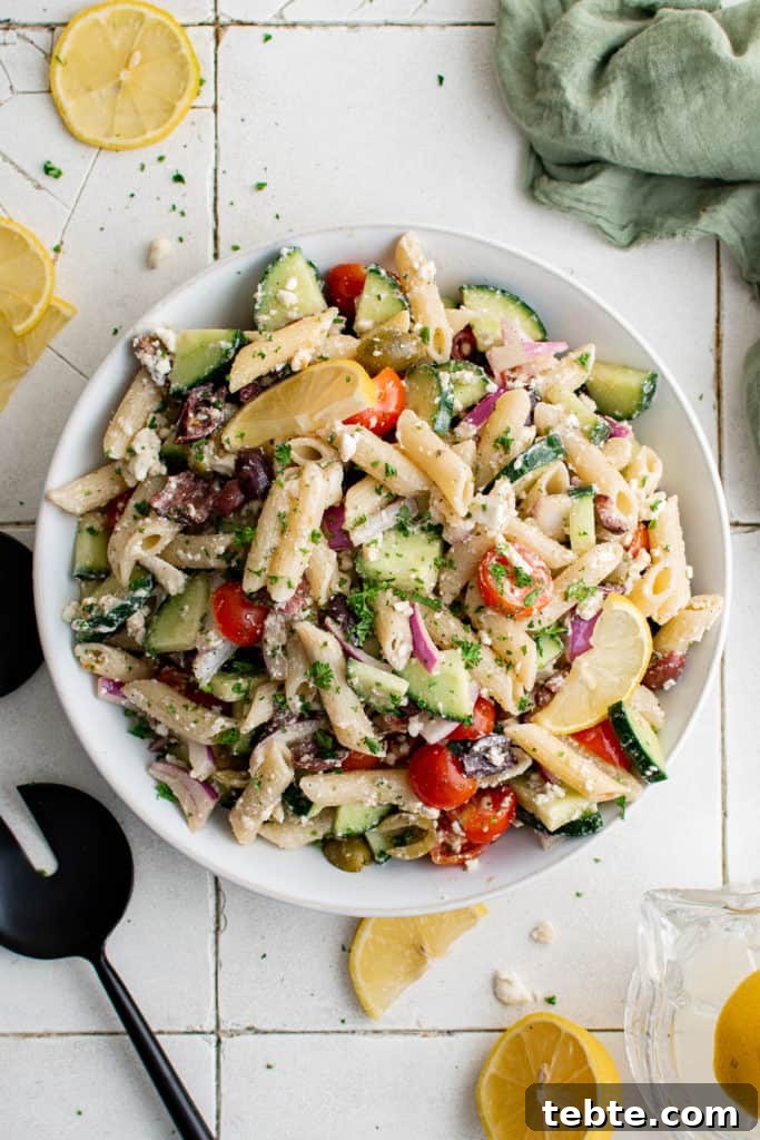 Mediterranean Greek Pasta Salad with Feta and Olives 2 Top down view of Greek pasta salad in a large serving platter.