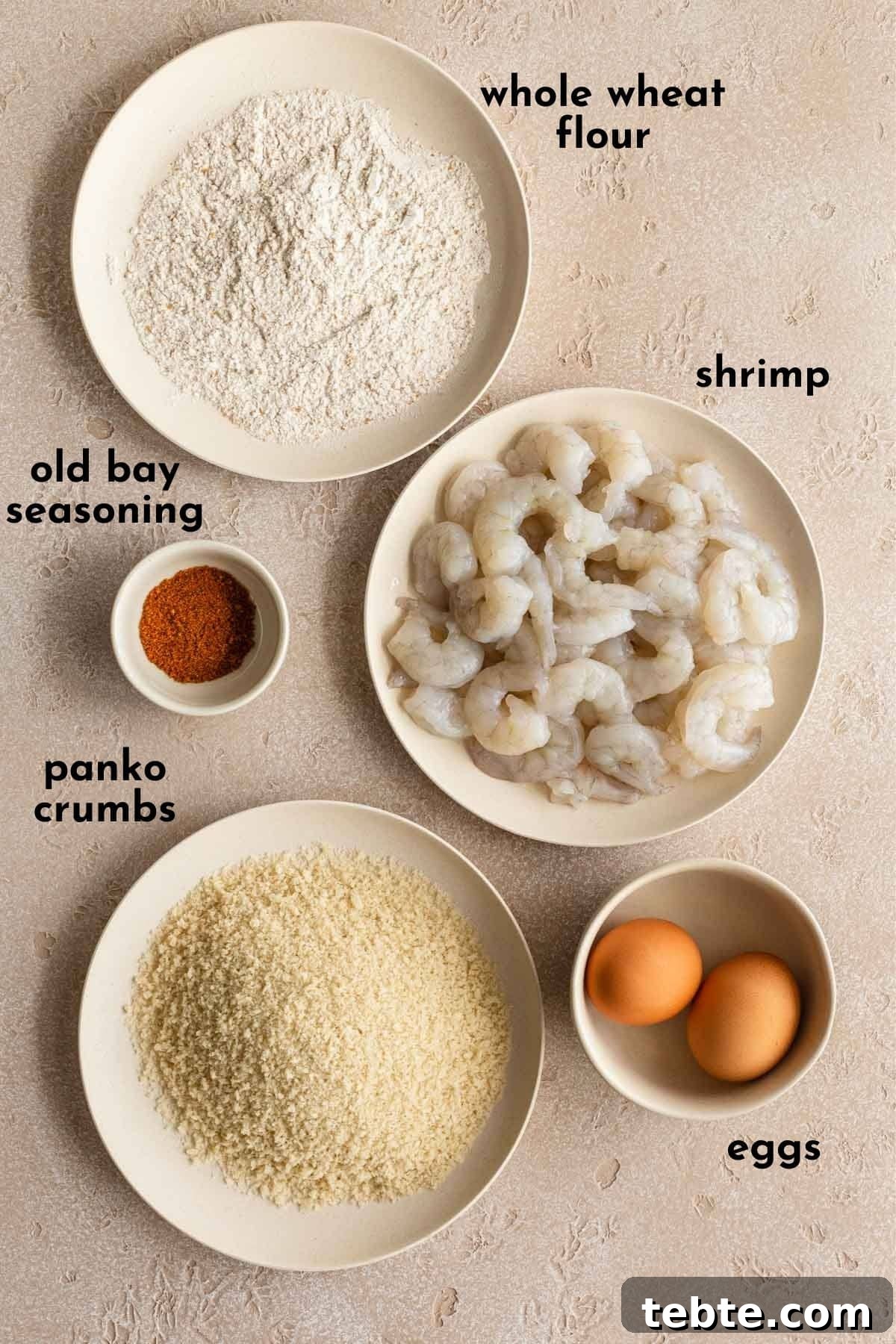 Crispy Air Fryer Breaded Shrimp Recipe for Quick Dinner 3 Ingredients to make breaded shrimp arranged individually and labelled.