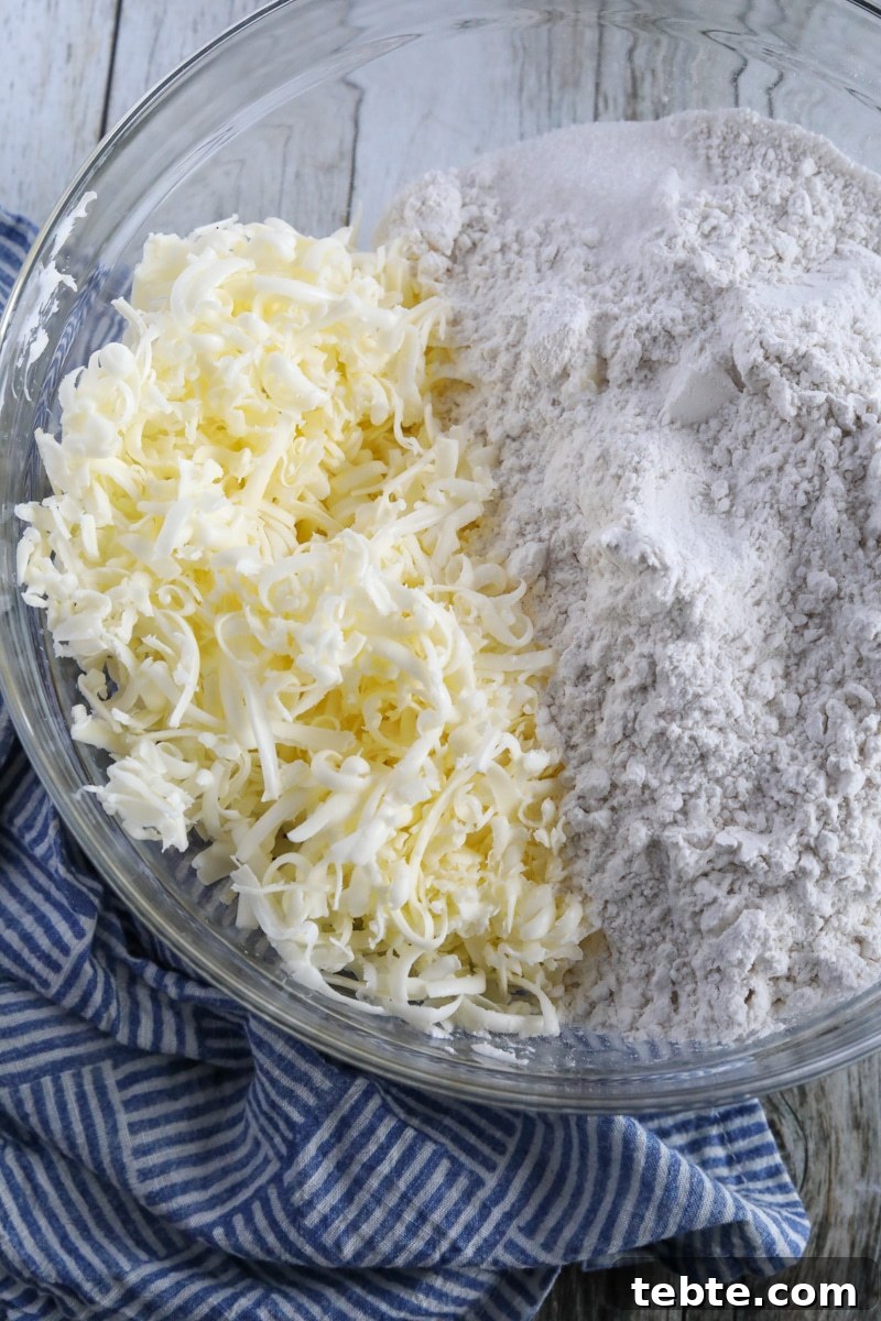 Flaky Homemade Biscuits Recipe — From Scratch and Delicious 3 shredded butter and flour in a glass bowl