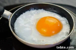 Classic Gammon Steak with Fried Egg and Chips 8 Cooking a duck egg in a mini frying pan