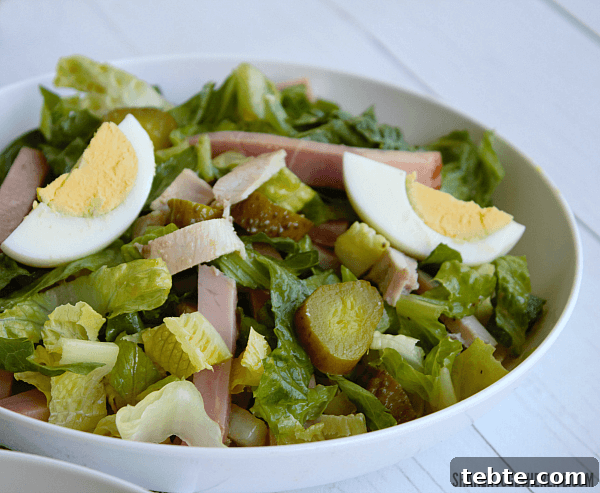 Cuban Cobb Salad with Zesty Mustard Vinaigrette 5 Cuban Cobb Salad in a white bowl