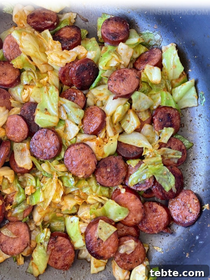 Sausage and Cabbage Skillet Dinner Recipe for Quick Weeknights 2 Easy Sausage & Cabbage Dinner Skillet | A super quick and easy last minute keto meal! This healthy and low carb dinner recipe is so simple to make with just a few cheap ingredients. Perfect for busy weeknight meals!