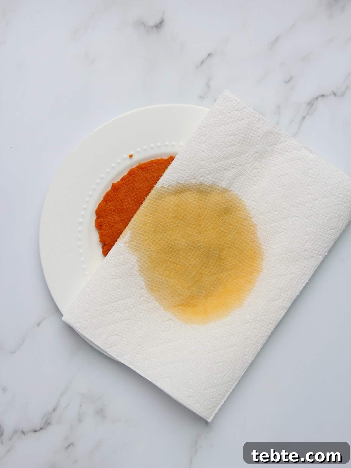 Pumpkin Cheesecake Cookies Recipe — Soft, Creamy Fall Treat 8 drying canned pumpkin purée with paper towel