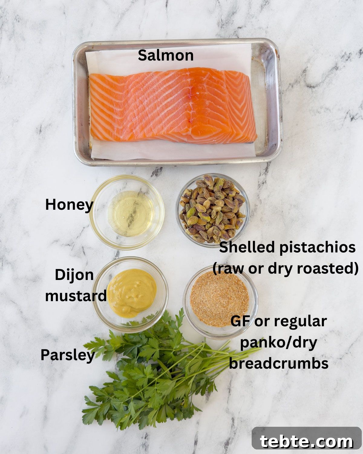 Oven-Roasted Salmon with Pistachio Crust 3 Ingredients for pistachio crusted salmon on a kitchen counter.