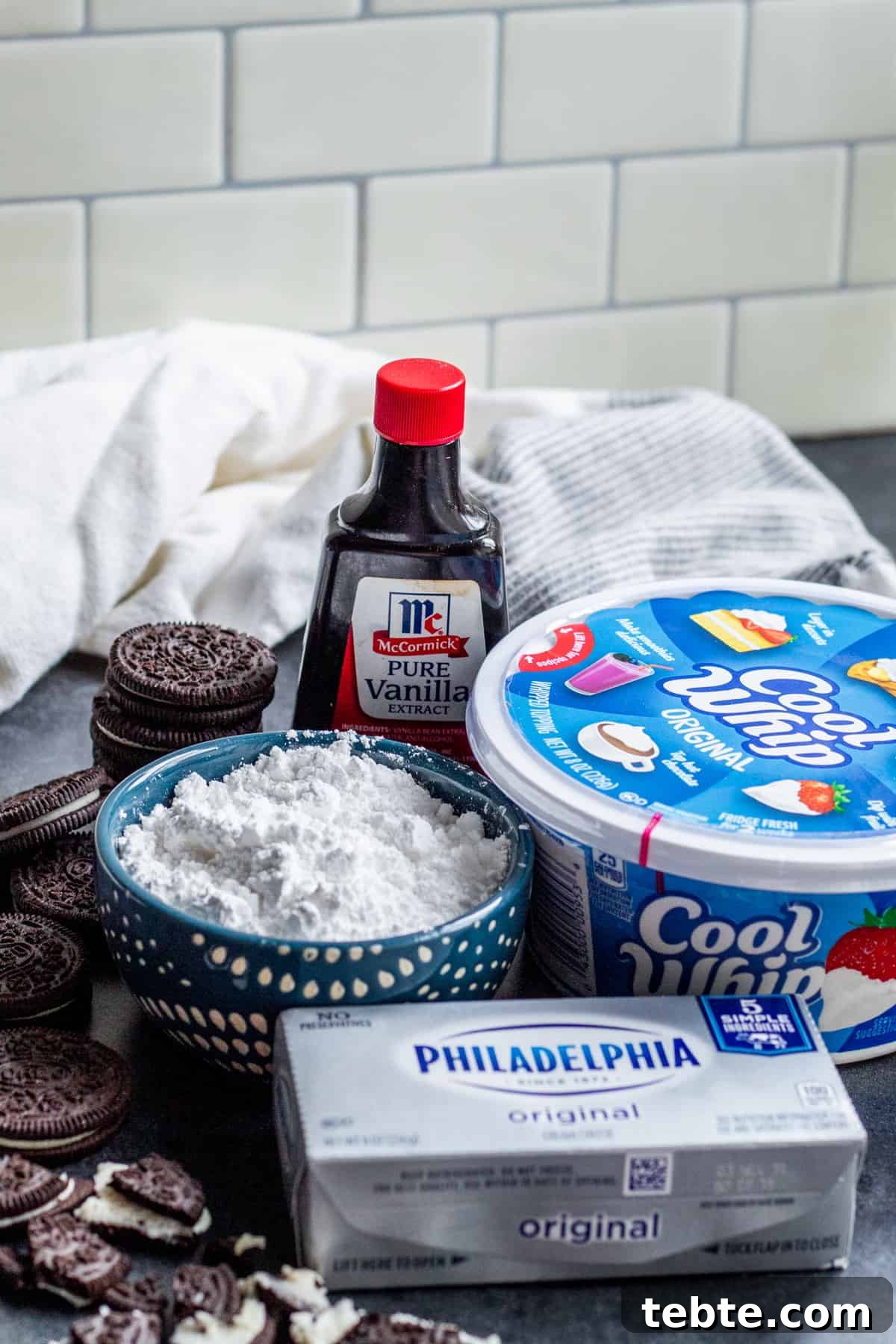 Creamy Oreo Dip Recipe for Parties and Dessert Tables 3 Ingredients for dessert recipe in bowls and packaging on counter.