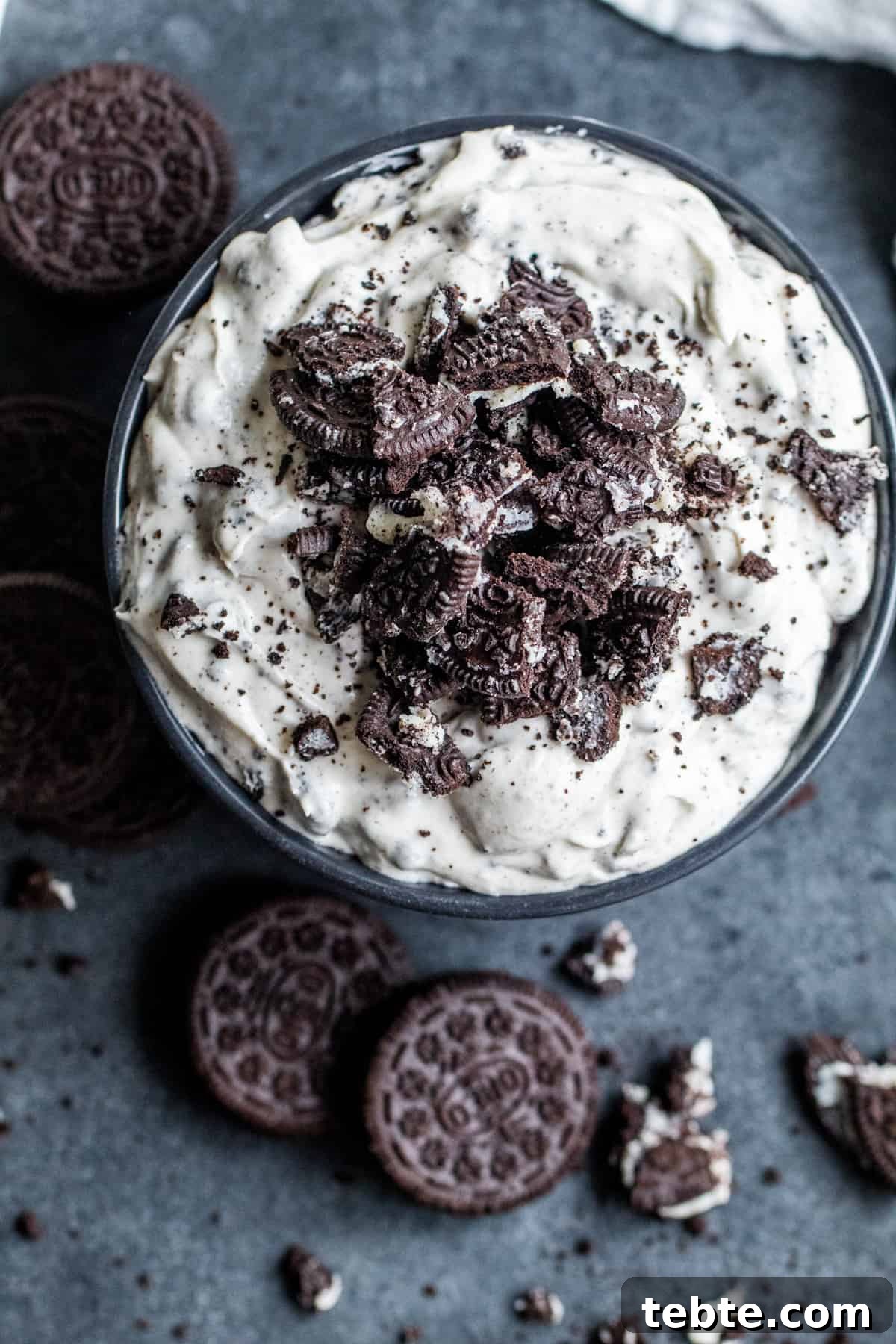 Creamy Oreo Dip Recipe for Parties and Dessert Tables 5 Overhead shot of recipe on counter with cookies scattered around.