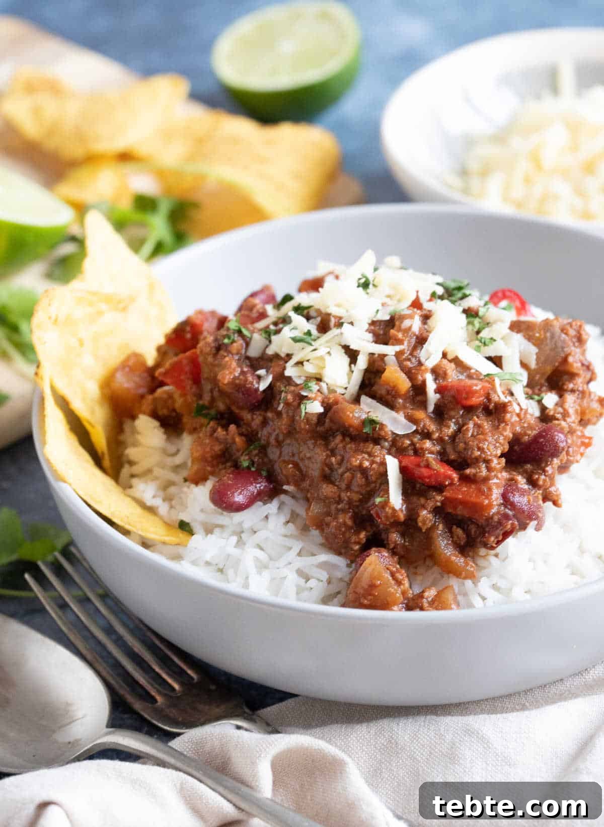 A bowl of slow cooker chilli con carne with chopped coriander.