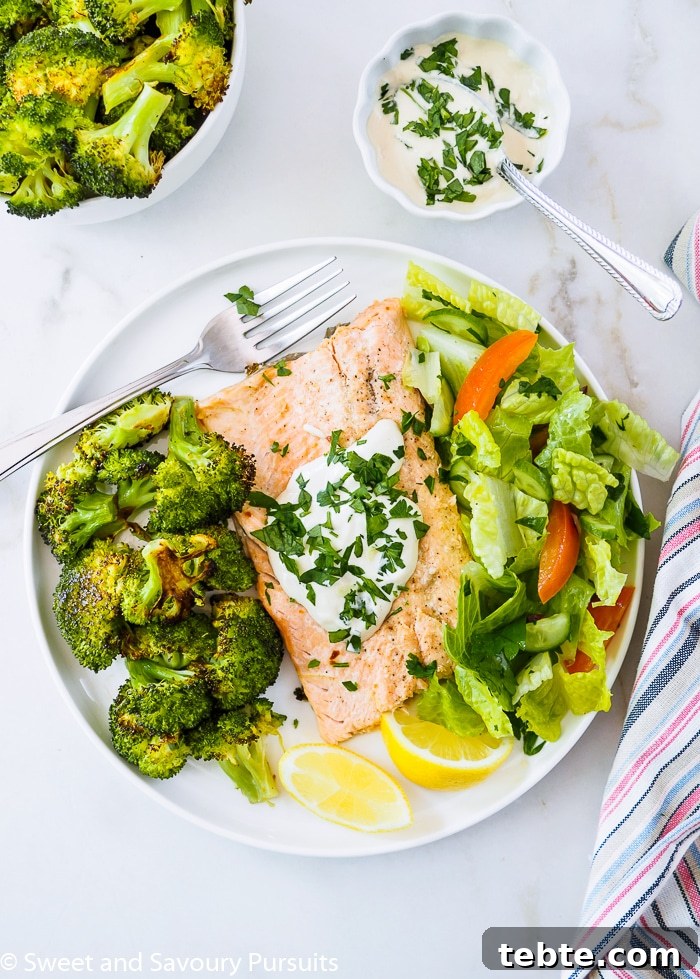 A serving of Baked Rainbow Trout Fillets with Roasted Broccoli on dish.