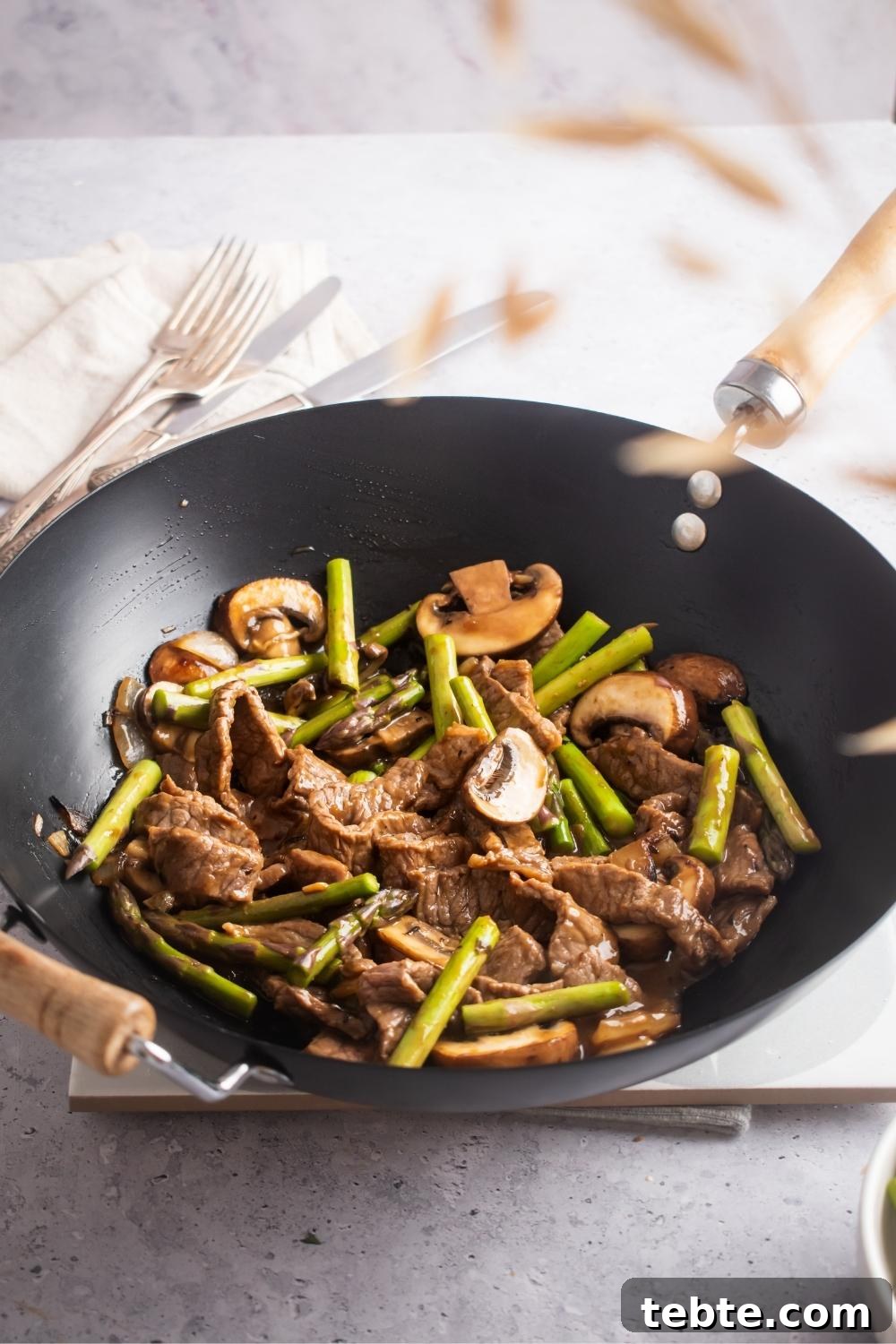 Panda Express Black Pepper Angus Steak Copycat Recipe 2 A wok containing homemade panda express black pepper steak.
