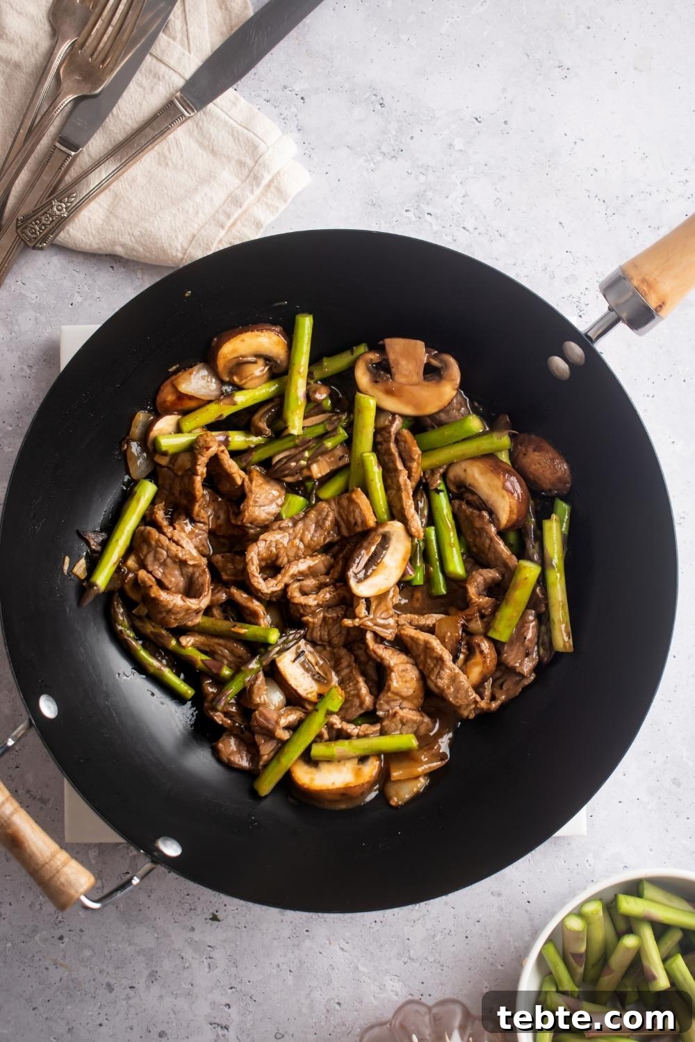 Panda Express Black Pepper Angus Steak Copycat Recipe 3 An overhead view of a wok containing homemade panda express black pepper steak.