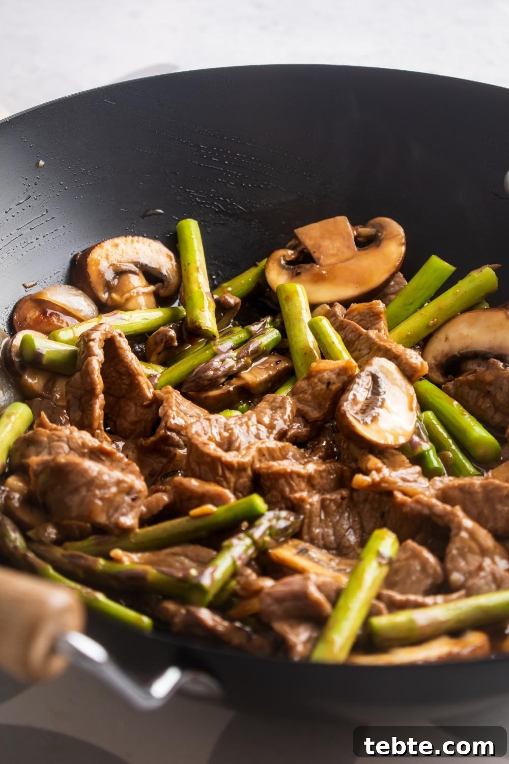 Panda Express Black Pepper Angus Steak Copycat Recipe 9 Close up of a wok containing homemade panda express black pepper steak.
