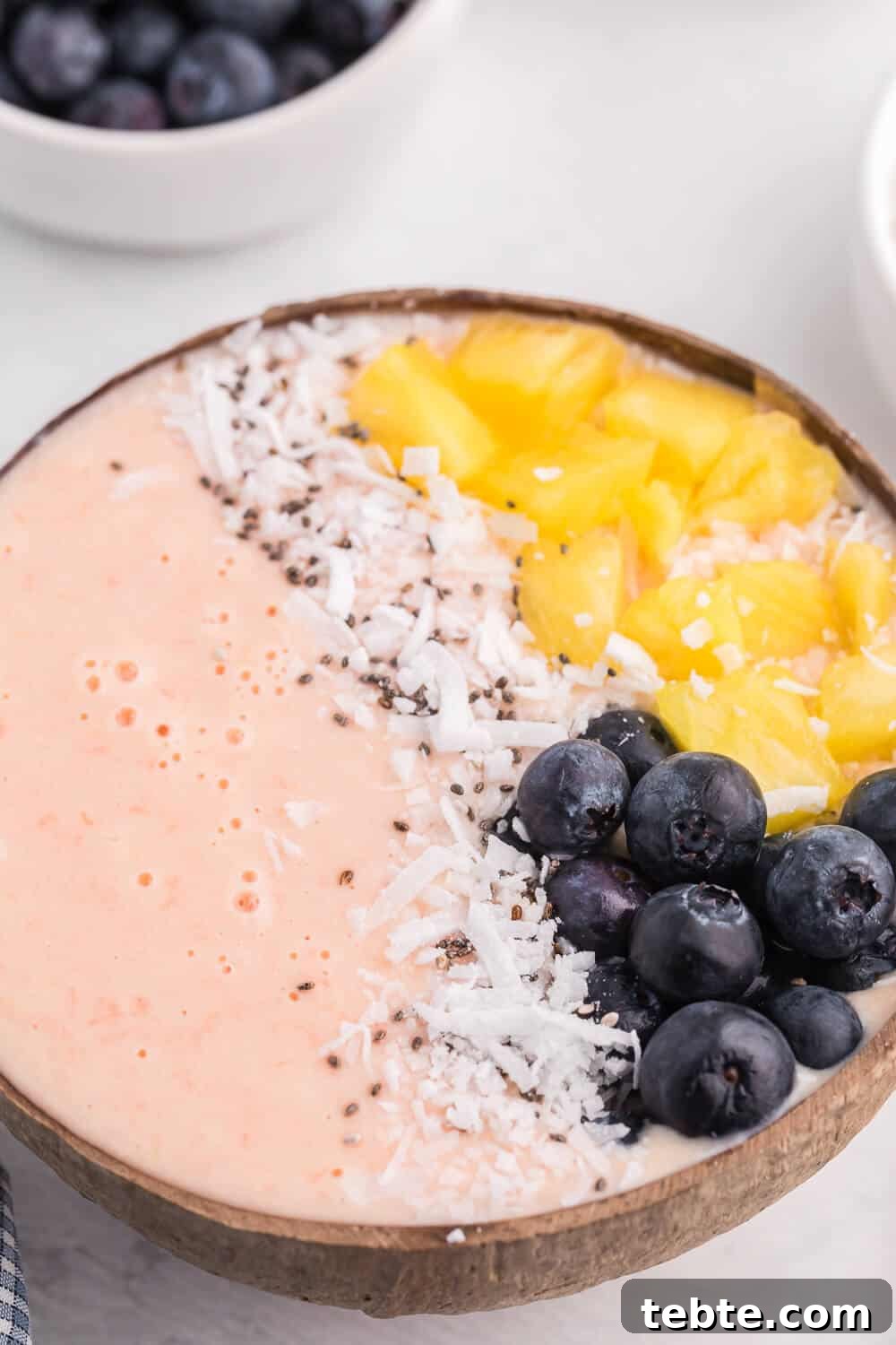 Citrus Grapefruit Smoothie Bowl Recipe for Bright Breakfast 4 Grapefruit Smoothie Bowl - This easy smoothie bowl recipe is healthy and naturally sweet way to kickstart your mornings. It's made with creamy blend of Sweet Scarletts Texas Red Grapefruit, Greek Yogurt, pineapple and a banana. Top it with some fresh blueberries, seeds and coconut. Yum!