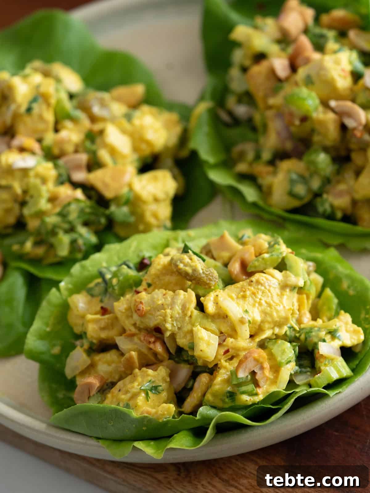 Creamy curried chicken salad served on lettuce wrap.