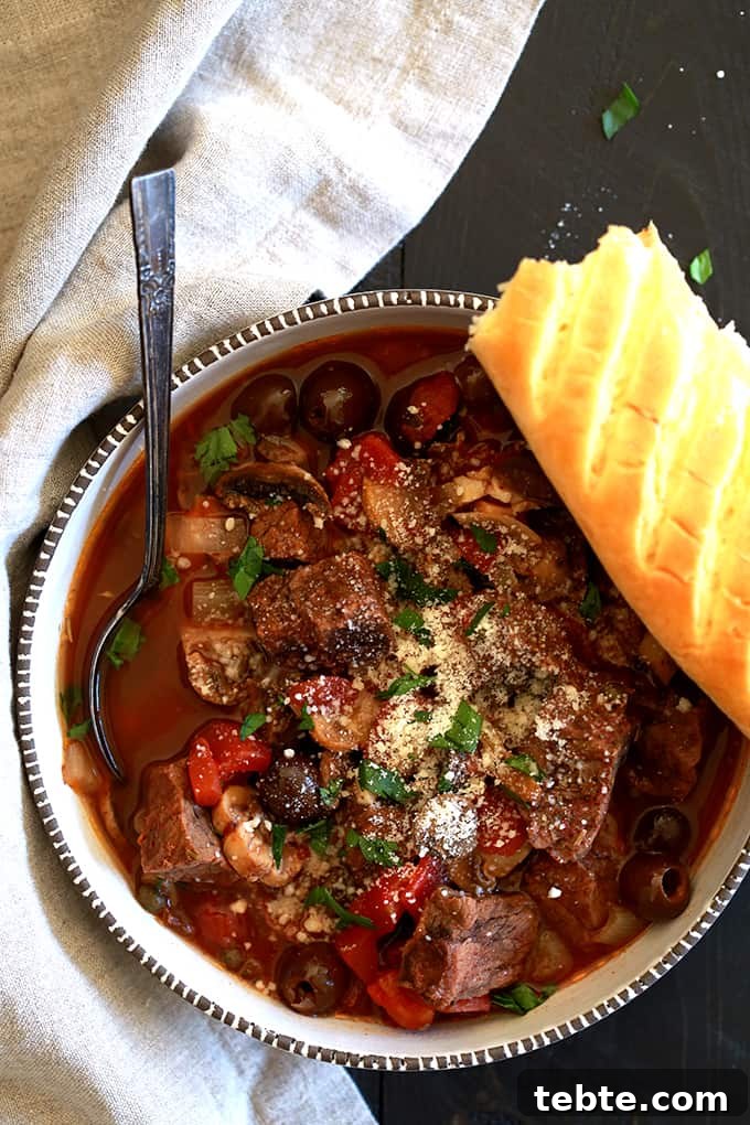 A balsamic vinegar spiked broth is the base of this Slow Cooker Mediterranean Beef Stew that's dotted with stew meat, tomatoes, mushrooms, olives and capers. Each bowl of this rich and hearty stew is then sprinkled with fresh parsley and grated Parmesan cheese which helps to brighten the flavors as well as to really up the flavor ante.