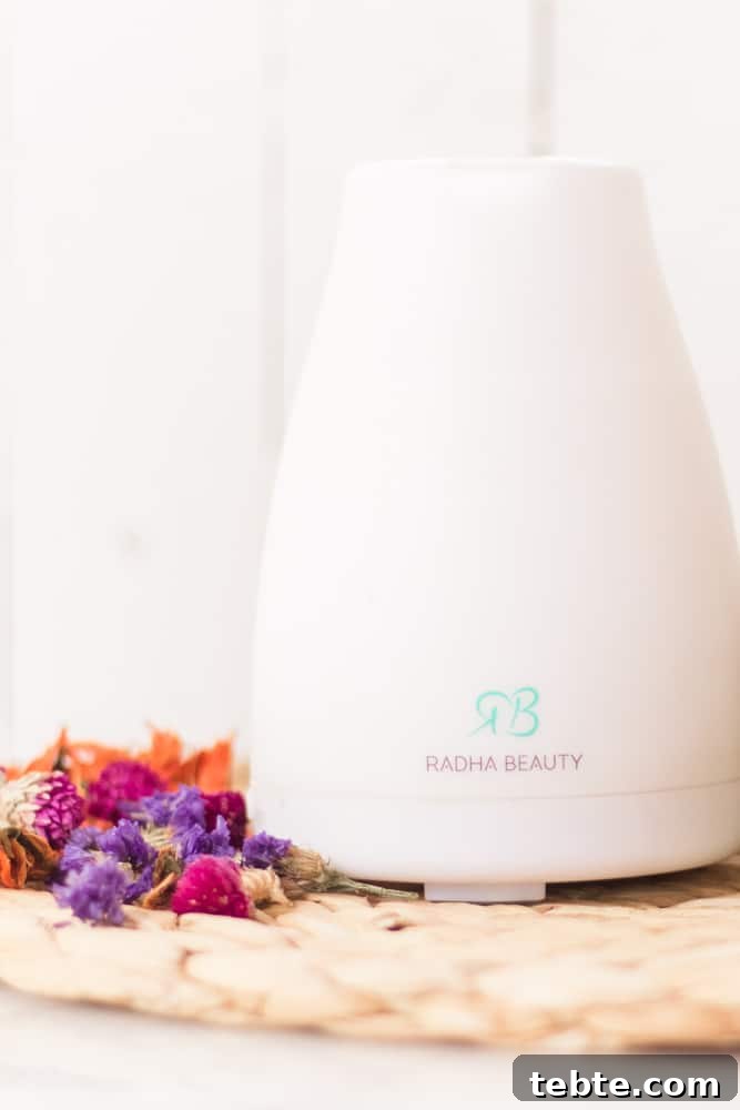 Tropical Essential Oil Diffuser Blends for Uplifting Scents 4 White diffuser with bright flowers next to it.