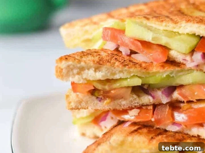 four onion tomato and cucumber sandwiches