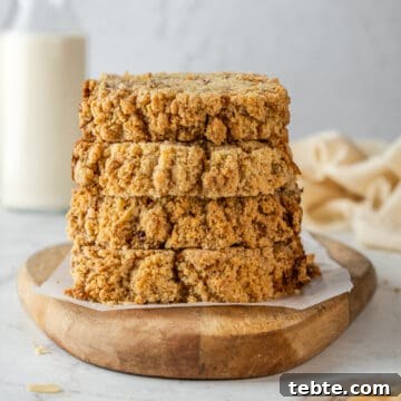 Stack of banana bread slices on a serving board.