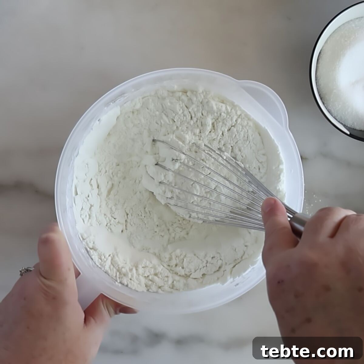 Gluten-Free Flag Cookie Cake Recipe for Patriotic Celebrations 4 whisking dry ingredients in plastic pitcher.