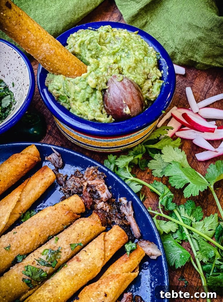 What to Make with Leftover Carnitas: Crispy Tacos & Bowls 3 leftover carnitas taquitos in guacamole