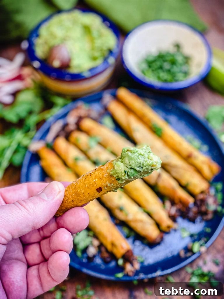 What to Make with Leftover Carnitas: Crispy Tacos & Bowls 4 taquito dipped in guacamole