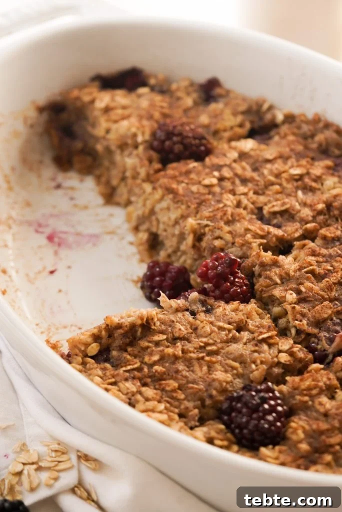 Blackberry Oat Bake with Oats and Warm Berry Filling 8 baked oatmeal with berries with a slice taken out