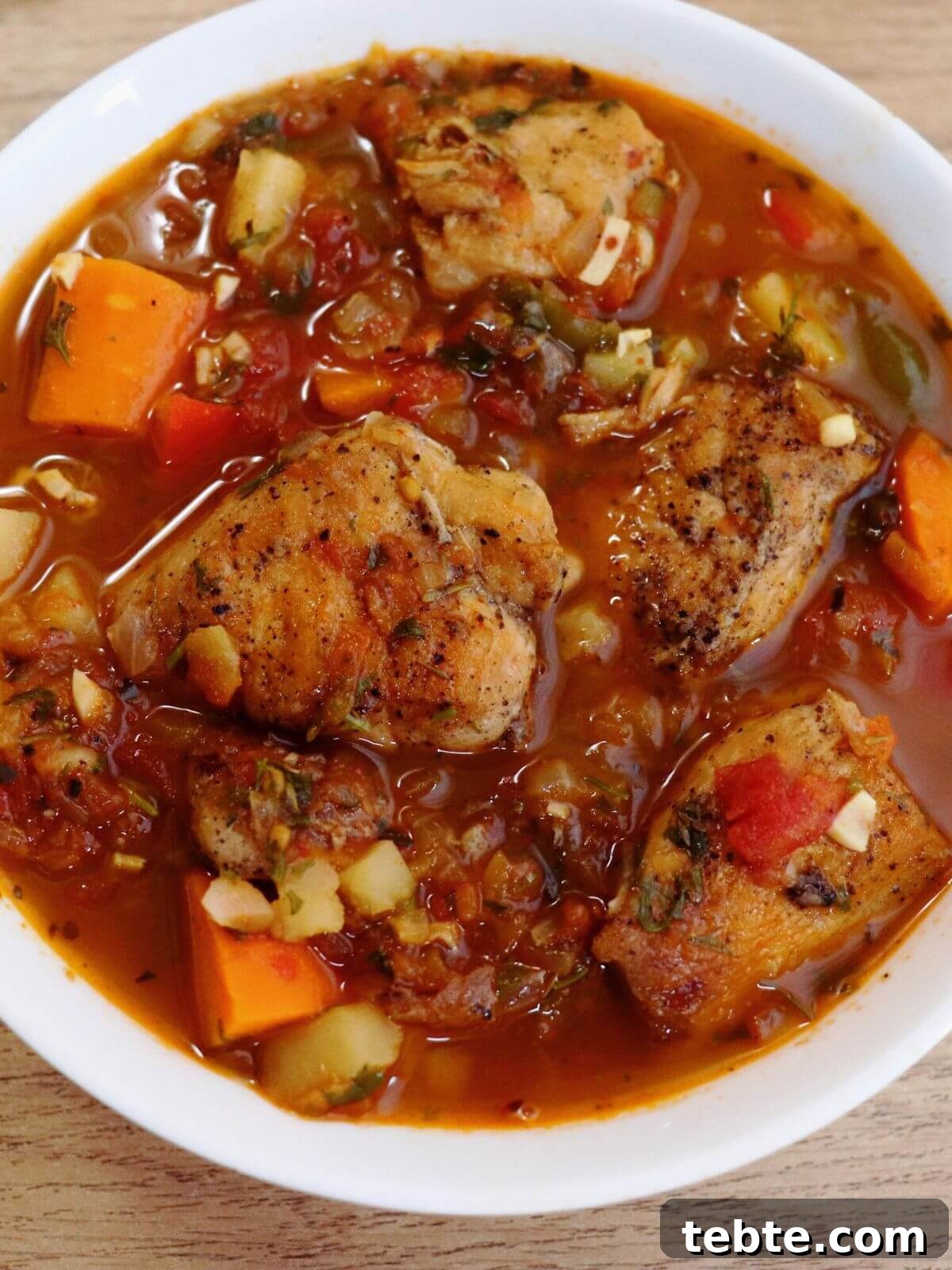 Mediterranean Chicken Stew with Olives, Tomatoes & Herbs 2 close-up of mediterranean chicken stew served in a bowl.