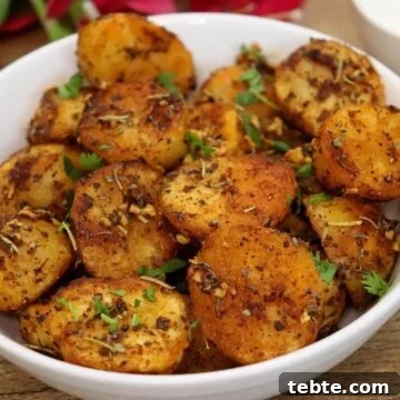 roasted mediterranean potatoes in a white colored bowl.