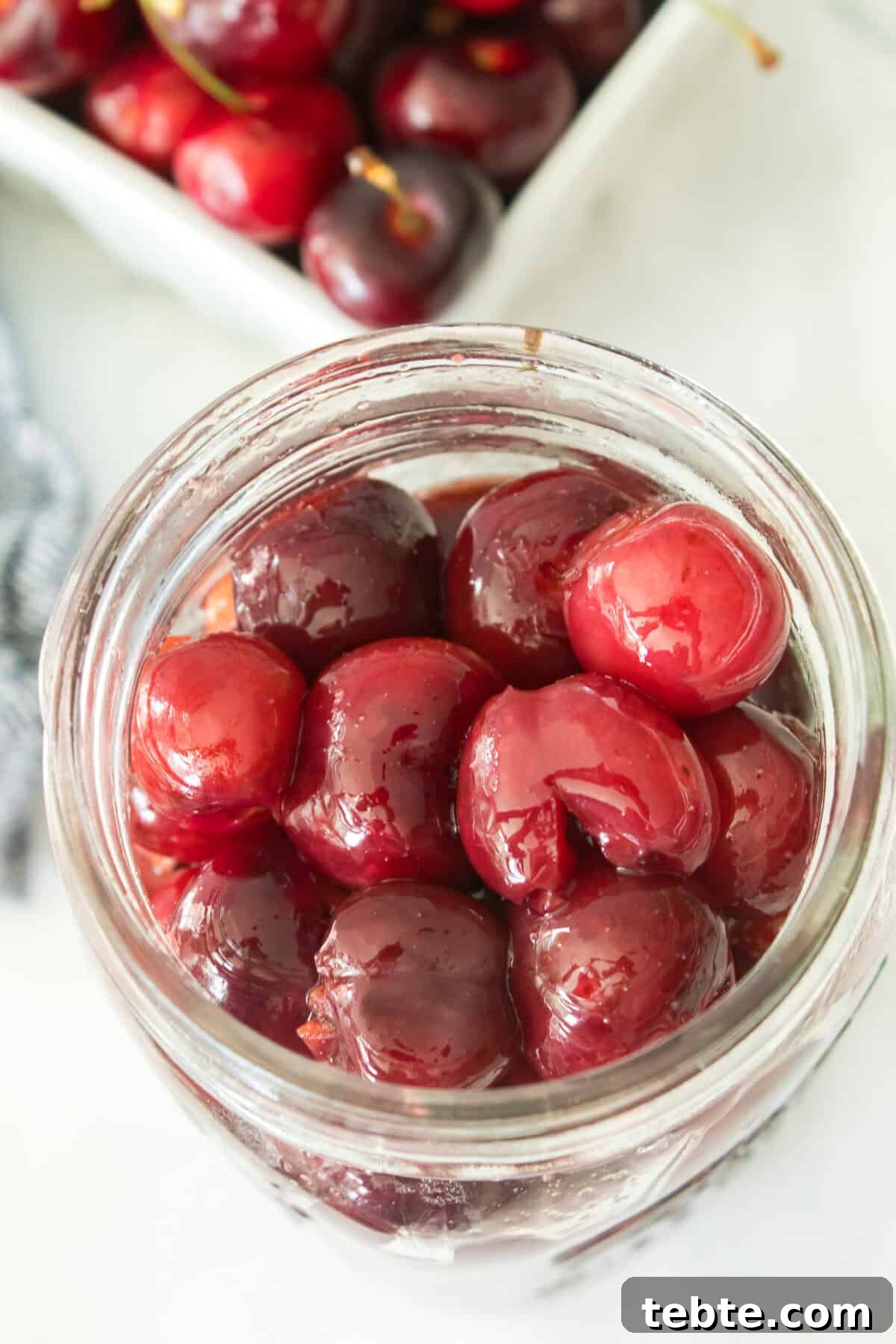 Gluten-Free Cherry Cobbler Recipe: Flaky Crust & Juicy Filling 4 close up overhead shot of homemade gluten-free cherry pie filling in mason jar