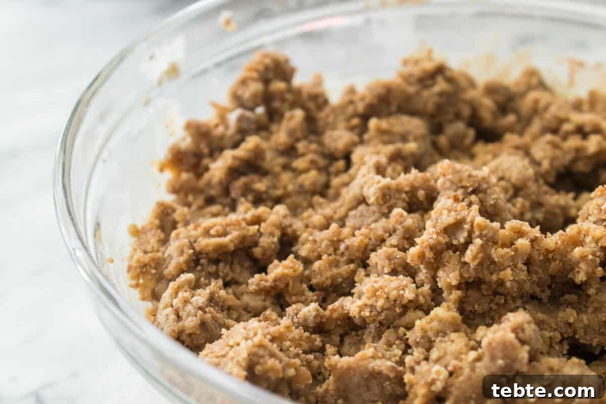 Gluten-Free Cherry Cobbler Recipe: Flaky Crust & Juicy Filling 5 glass bowl with gluten-free cobbler topping that's been mixed together