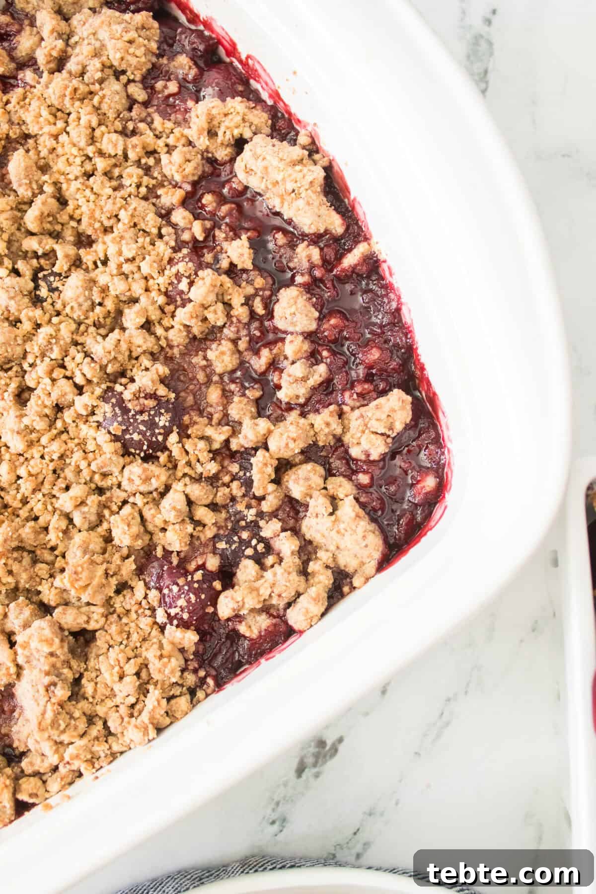 Gluten-Free Cherry Cobbler Recipe: Flaky Crust & Juicy Filling 8 overhead close up shot of baked gluten-free cherry cobbler