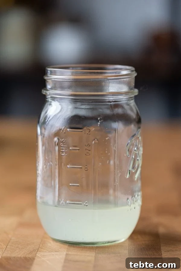 How to Press Tofu: Quick Methods With and Without a Tofu Press 6 mason jar filled with about 1/2 cup of excess liquid from a block of tofu