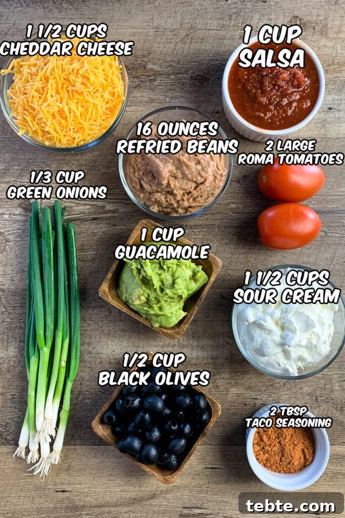 Authentic Mexican 7-Layer Bean Dip Recipe for Entertaining 3 All the ingredients needed to make the best seven-layer bean dip.