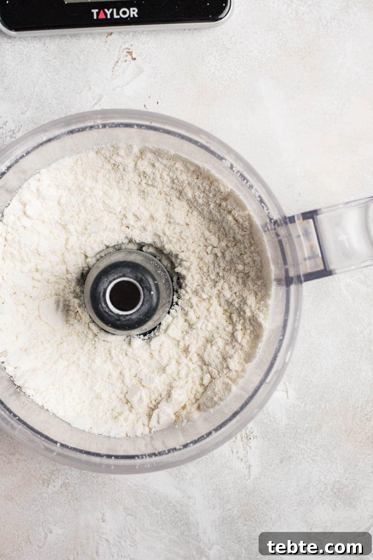 almond flour and powdered sugar mixed in food processor 