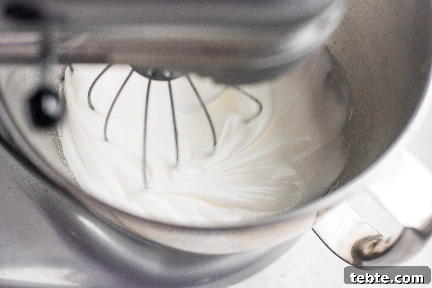 meringue being beaten in mixer