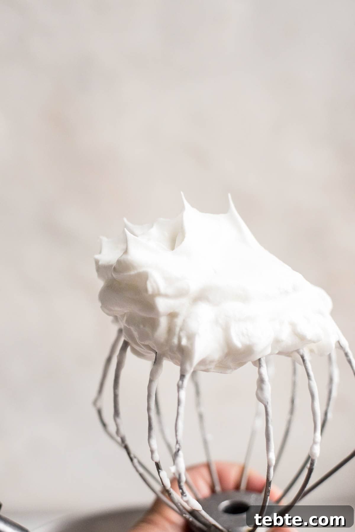 checking stiff peaks for meringue