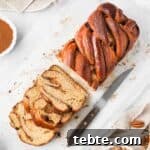 Cinnamon Babka Recipe: Soft, Swirled Brioche Loaf 10 Cinnamon Babka seen from above with 3 slices cut off.