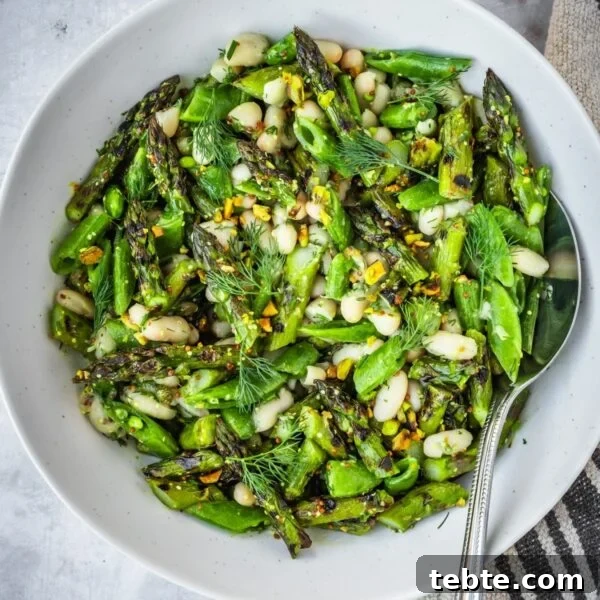 Grilled Asparagus and White Bean Salad with Lemon Vinaigrette 11 Grilled asparagus and white bean salad in a large bowl.