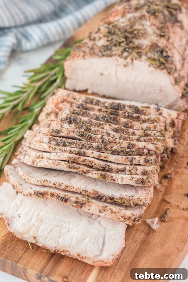 Rosemary Pork Roast sliced rosemary pork roast on a cutting board