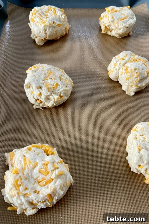 Cheddar Bay Biscuits Copycat Recipe from Red Lobster 4 biscuits ready to be baked