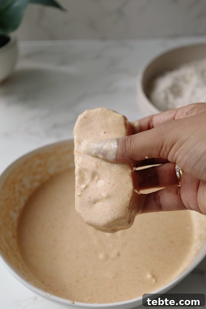 Crispy Buffalo Tofu Tenders (Air Fryer Recipe) 6 step two: coat in the wet batter.