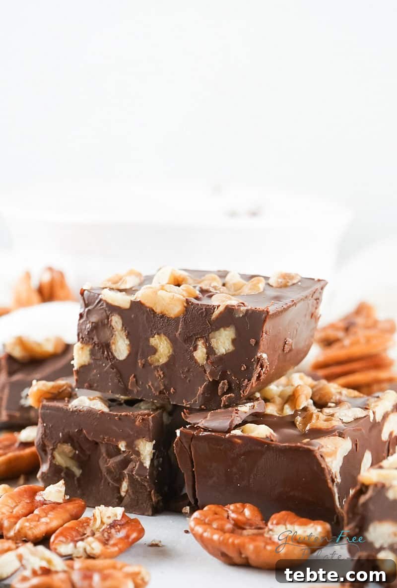 Quick 2-Ingredient Nutella Fudge Recipe 6 three pieces of Nutella fudge stacked on top of one another