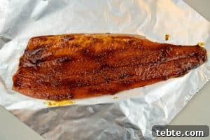 Spreading the spice oil over the fish