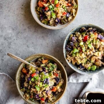 overhead of three bowls of Asian cauliflower rice