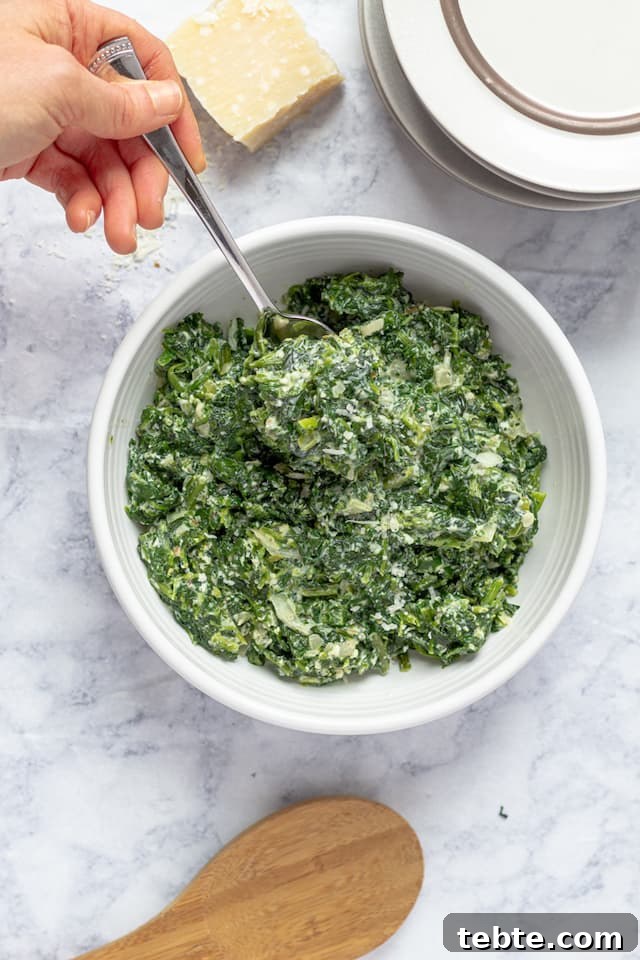 Lighter Creamed Spinach Recipe: Rich Flavor, Fewer Calories 2 Healthy Creamed Spinach in Bowl with Spoon